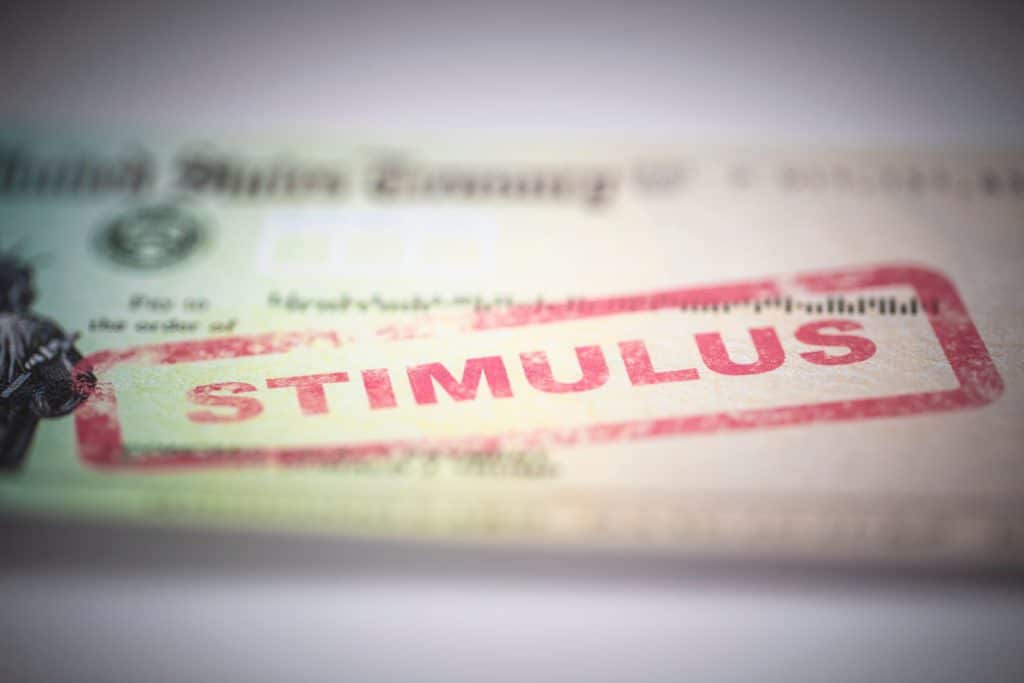A stamp with the word stimulus check on it.