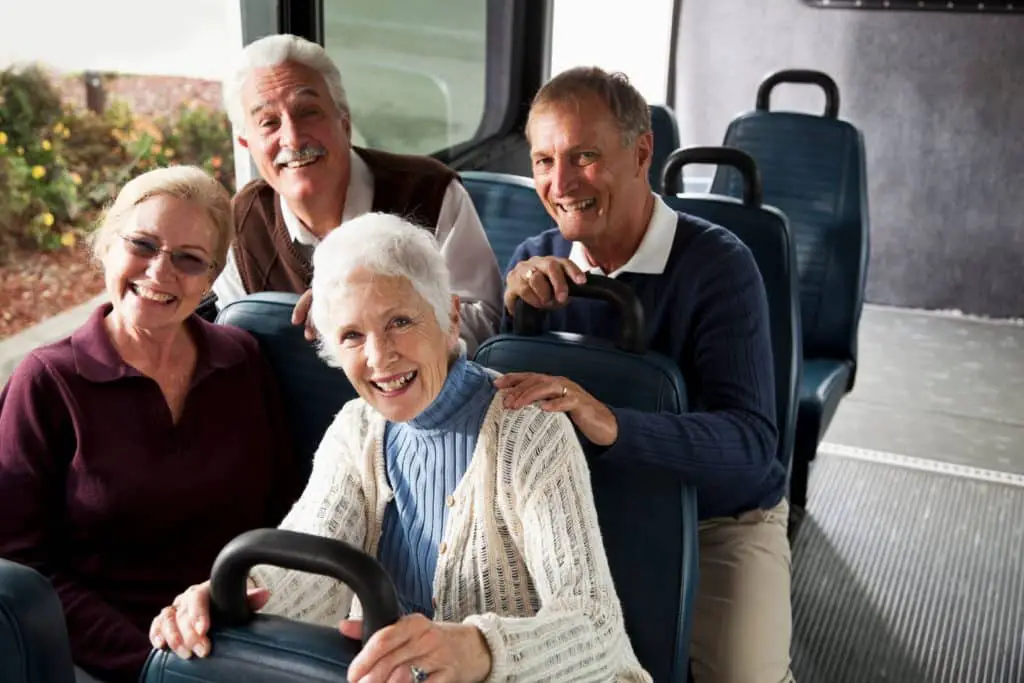 A group of seniors enjoying a bus tour.