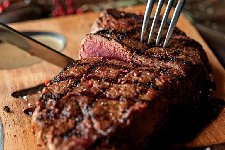 A succulent steak on a cutting board awaits diners at Texas Roadhouse, where age comes with the added benefit of a senior discount.